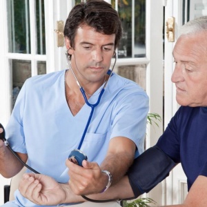 doctor-taking-the-blood-pressure doctor-taking-the-blood-pressure