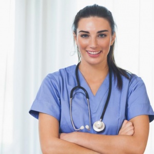 happy-nurse-with-arms-crossed happy-nurse-with-arms-crossed